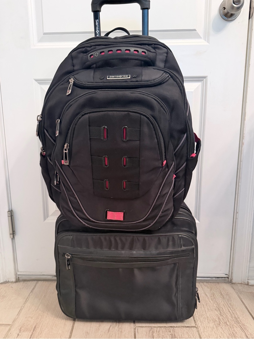 Samsonite Black with Pink Accent Rolling Backpack and Carry-On